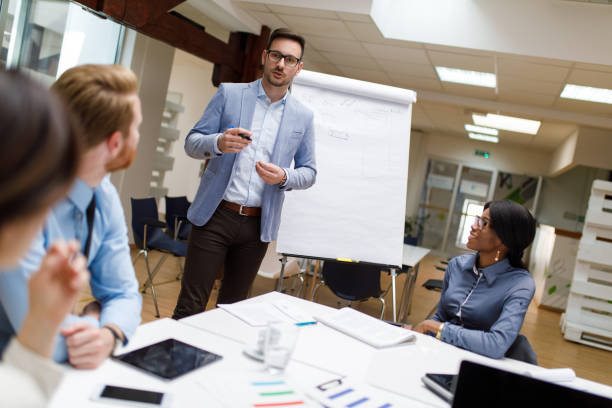 istock Businessman presenting new project to partners in the office 914461698