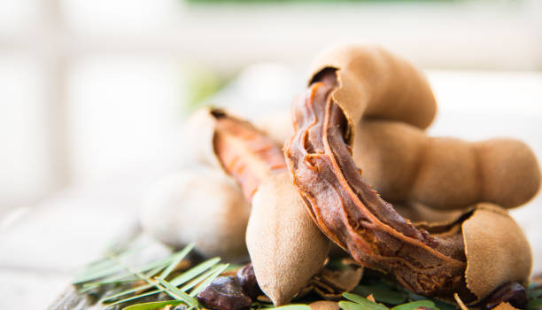 istock Close up tamarind on wood texture. 914461998
