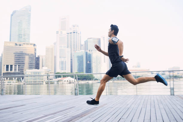 istock Training and running in Singapore's Marina Bay waterfront, Asia 914462182