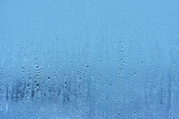 istock Natural blue water drop background on glass 914466748