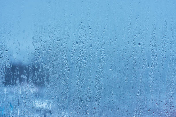 istock Natural blue water drop background on glass 914466774