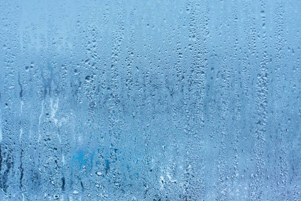 istock Drops water on the clear glass background 914466924