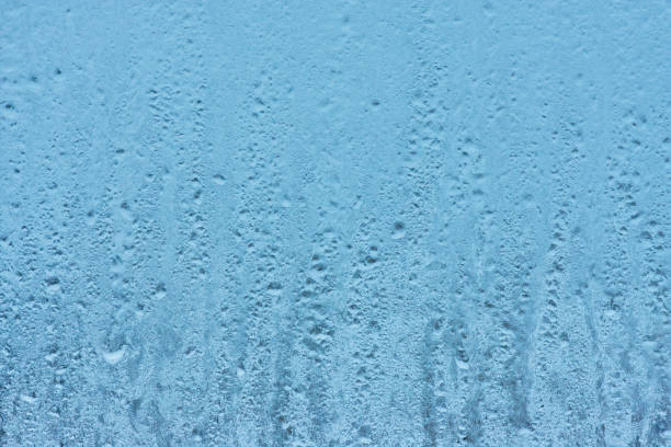 istock Frozen glass, ice texture on window, natural background 914467192