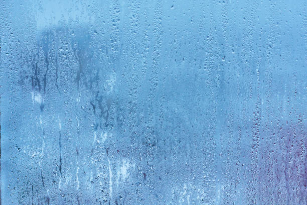 istock Natural blue water drop background on glass 914467196