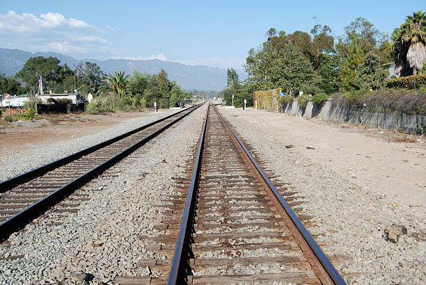 istock Railroad Tracks with Mountains in the distance 91446939