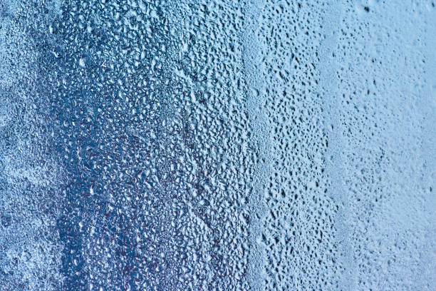 istock Frozen glass, ice texture on window, natural background 914469772