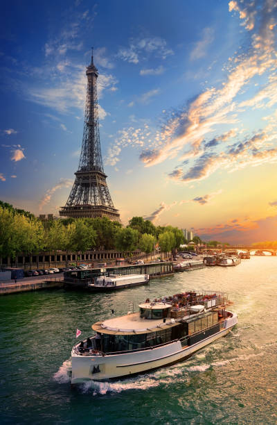 On bank of Seine Eiffel tower on the bank of Seine in Paris, France seine river stock pictures, royalty-free photos & images