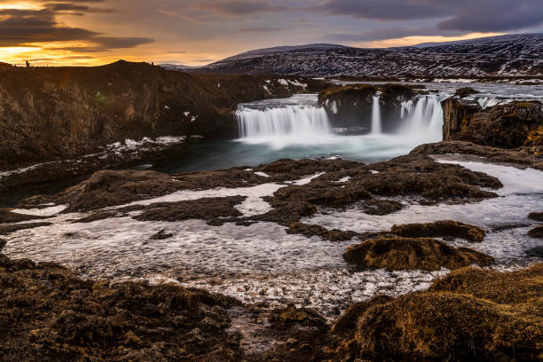 istock water flowing from frozen godafoss waterfalls, Iceland 914473474