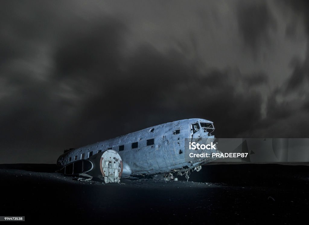 DC plane crash in Icelandic land landscape view at night Abandoned Stock Photo