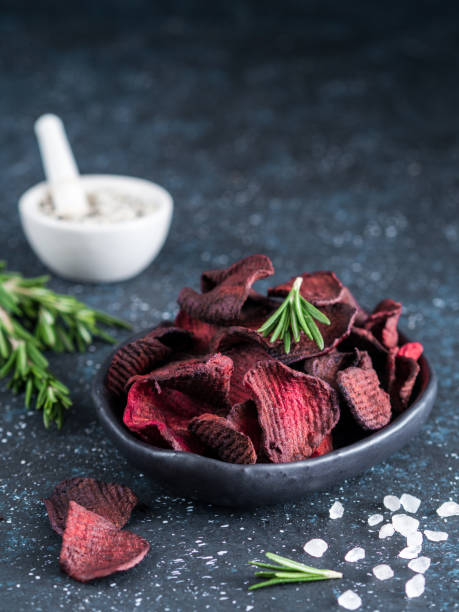 Baked beet slices. Healthy beetroot chips stock photo