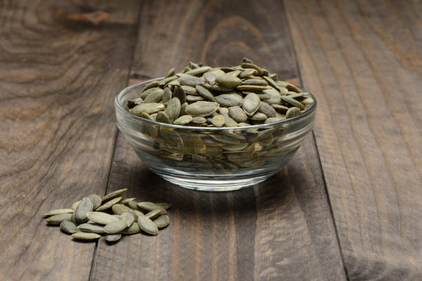 istock Peeled pumpkin seeds in a glass bowl 914474472