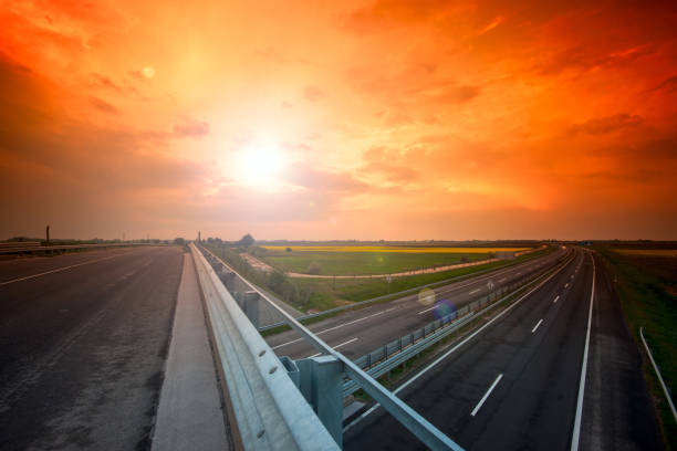 istock Cars speeding on a highway 914474646