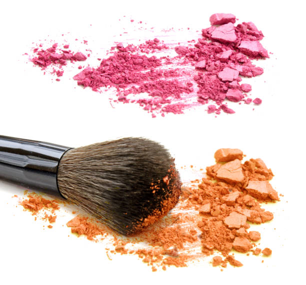 istock Pink and orange crushed powder and blush isolated on white background 914474672