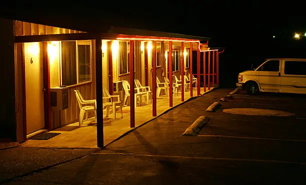 Small motel lit up at night, California