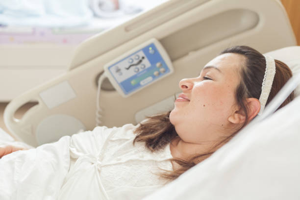 istock Excited patient lying on bed at hospital 914478102