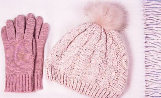 istock Warm winter knitted clothes on a wooden background. 914478202