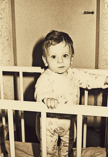 istock Vintage baby boy looking at camera 914478630