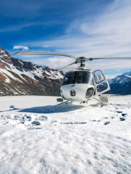 istock Helicopter Landing on a Snow Mountain 914479020