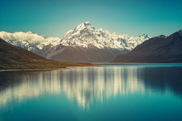 Mount Cook landscape reflection on Lake Pukaki, the highest mountain in New Zealand and popular travel destination. The mountain is in Aoraki Mount Cook National Park in South Island of New Zealand.