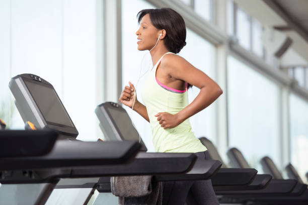 istock Woman exercising on treadmill. 914481670