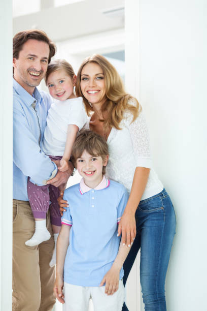 istock Happy family in doorway 914484968