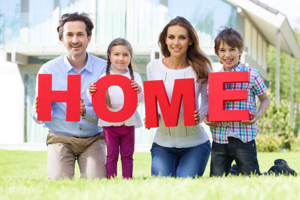 istock Happy family and their house 914484970