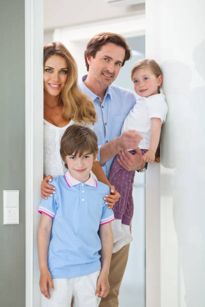 istock Happy family in doorway 914485096