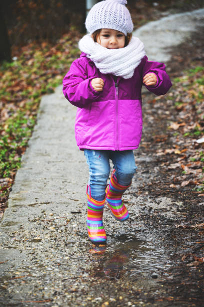 istock Child in rubber boots on a rainy day 914485692