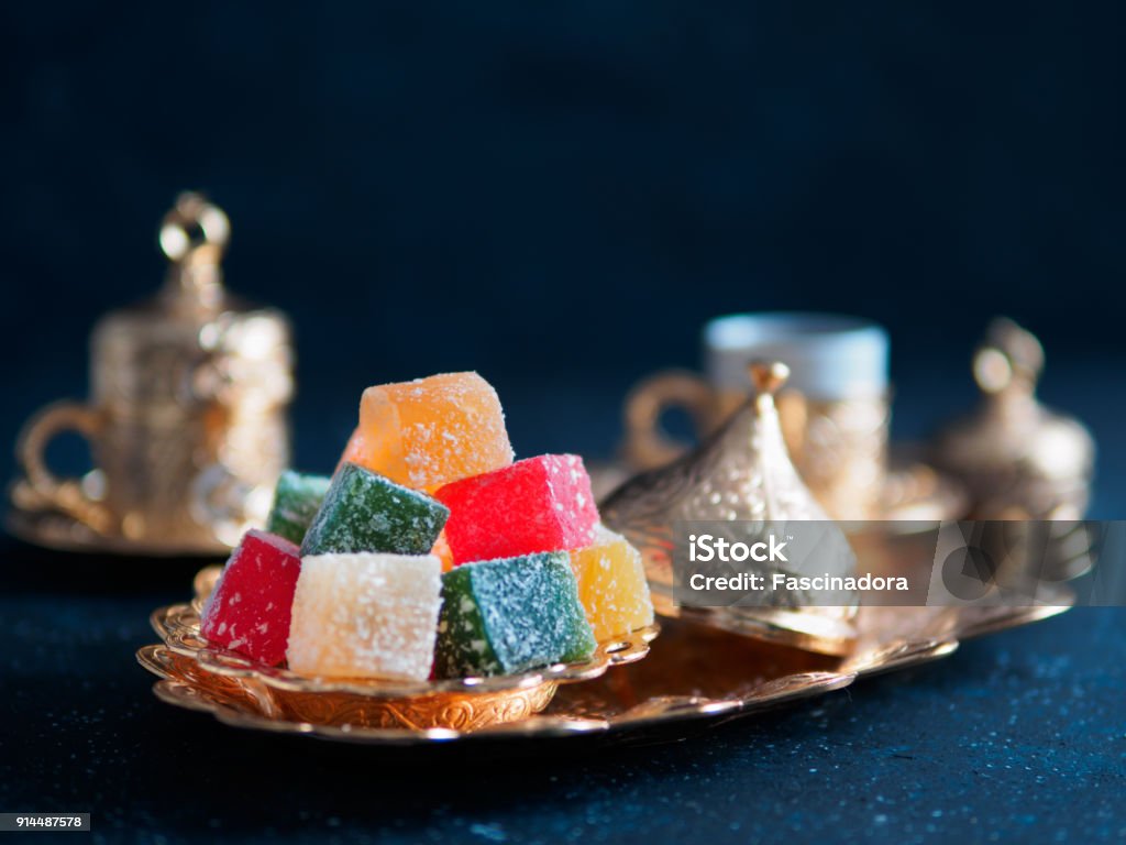 Turkish delight and turkish coffee Turkish coffee with delight and traditional copper serving set on dark background. Assorted traditional turkish dilight or lokum and turkish coffee in metal traditional cups.Copy space.Selective focus Türkiye - Country Stock Photo