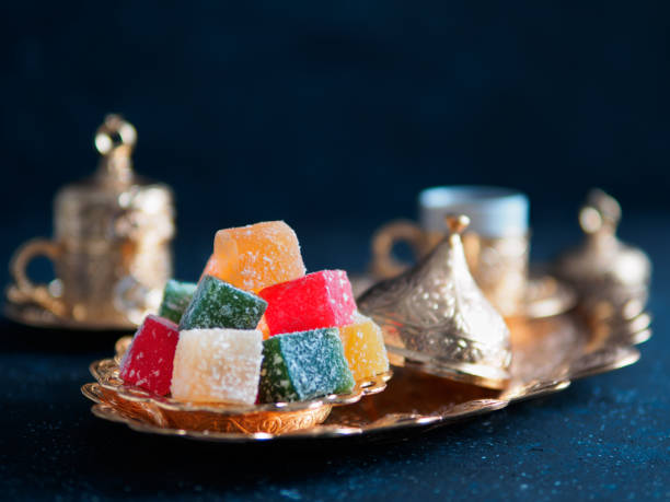 Turkish delight and turkish coffee Turkish coffee with delight and traditional copper serving set on dark background. Assorted traditional turkish dilight or lokum and turkish coffee in metal traditional cups.Copy space.Selective focus cezve stock pictures, royalty-free photos & images