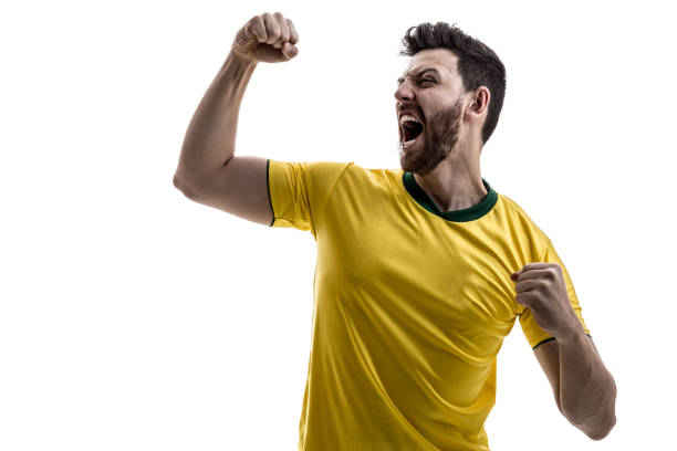 brazilian male athlete / fan celebrating on white background - fan sport football male imagens e fotografias de stock