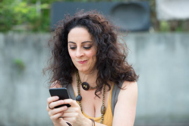 istock Beautiful Woman Reading Text Message Little Upset 914498148