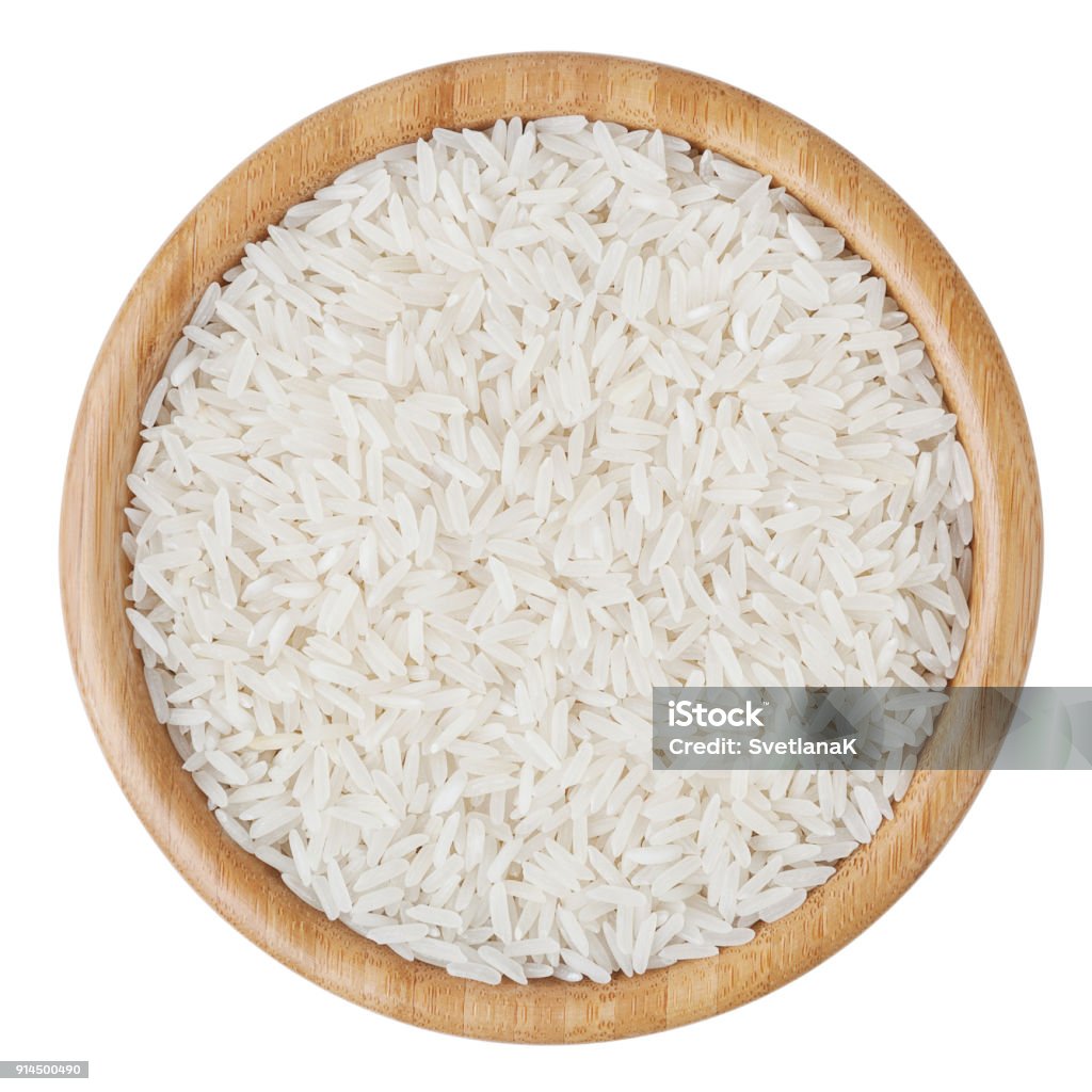 Top view of white long-grain rice in wooden bowl isolated on white background with clipping path Rice - Food Staple Stock Photo