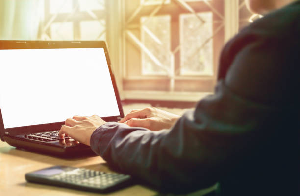 istock Blur working on phone and computer with sunset business concept background. 914500566