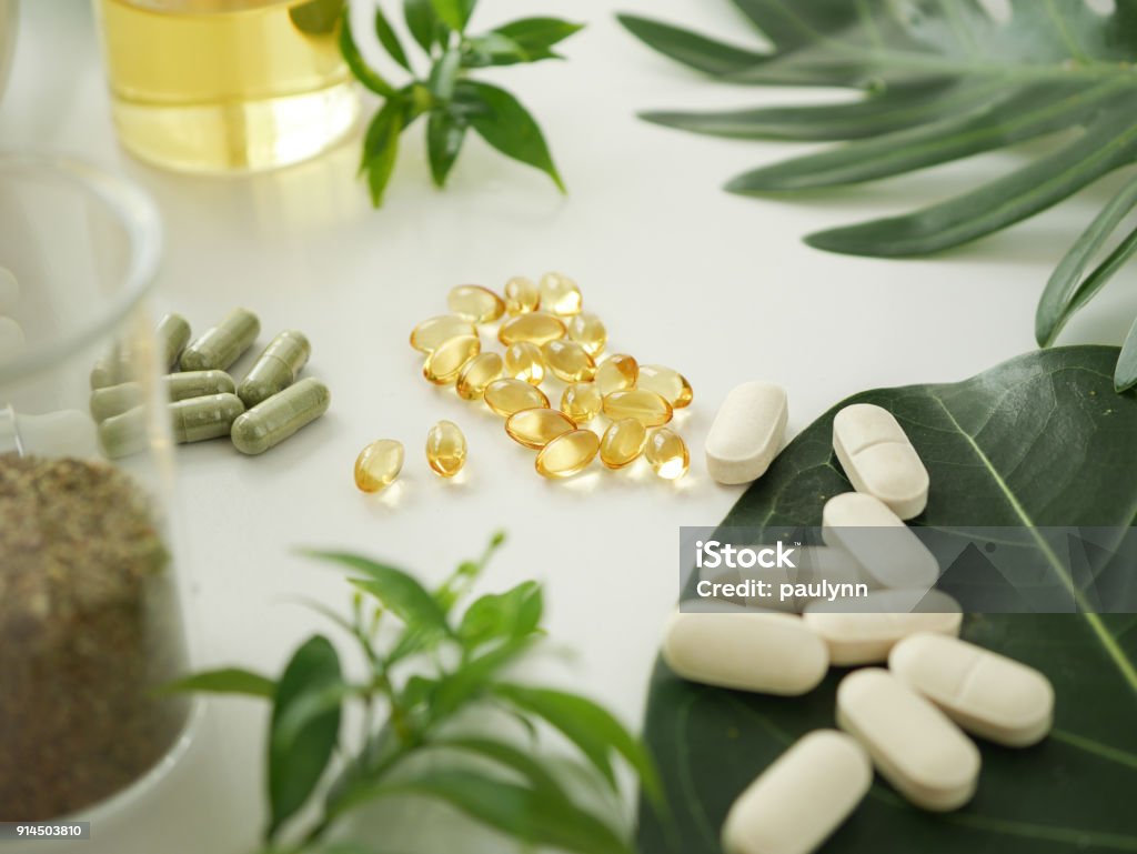 alternative herb medicine. herbal vitamin on white background. Nutritional Supplement Stock Photo