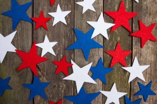 Blue, white and red stars. Wooden old background. Presidents day. American holiday.