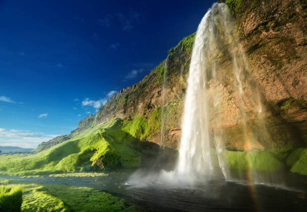 Seljalandsfoss is an iconic waterfall in South Iceland with a waterfall that drops 197 feet and is a spectacular sight to see.