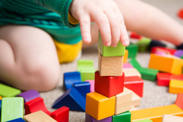 istock Baby playing with toy building blocks 914515502