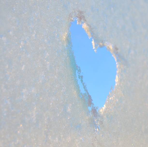 istock Heart shape drawn on a frozen window 914515684