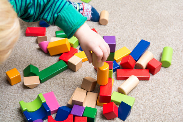istock Baby playing with toy building blocks 914515726