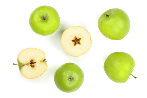 istock green apples with slices isolated on white background top view. Set or collection. Flat lay pattern 914516898