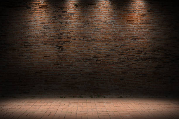 istock Industrial empty grunge urban street with warehouse brick wall with light effect. 914516924