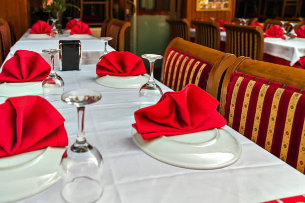 istock Glasses and plates on reserviert table in restaurant 914519702