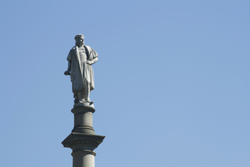 Close-up of the statue of Juan Ponce de Leon, the Spanish explorer best known for being the first governor of Puerto Rico during 1508-1509, and San Jose Church, Old San Juan, Puerto Rico