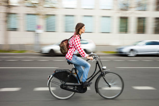 istock Woman cycling in Berlin downtown 914524346