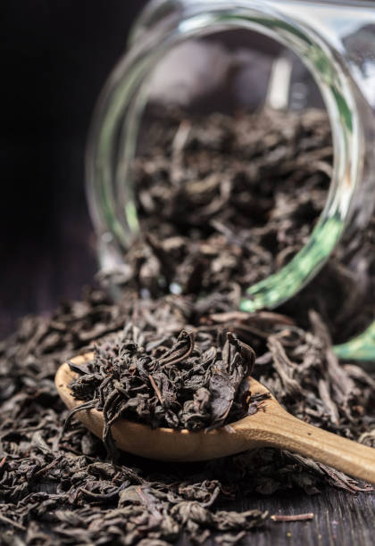 istock dry tea poured out of the jar 914526796