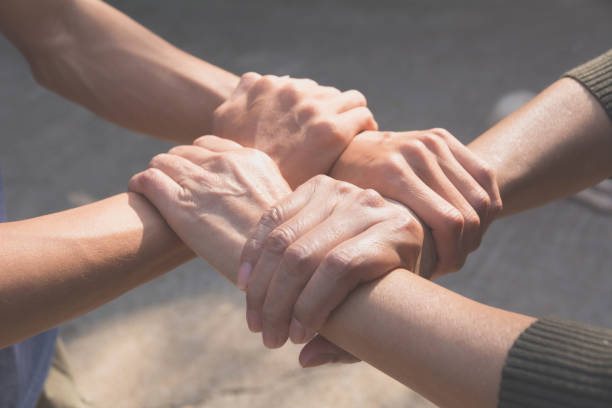 istock Teamwork concept. People joining for cooperation success. Collaboration concept of teamwork. 914530032