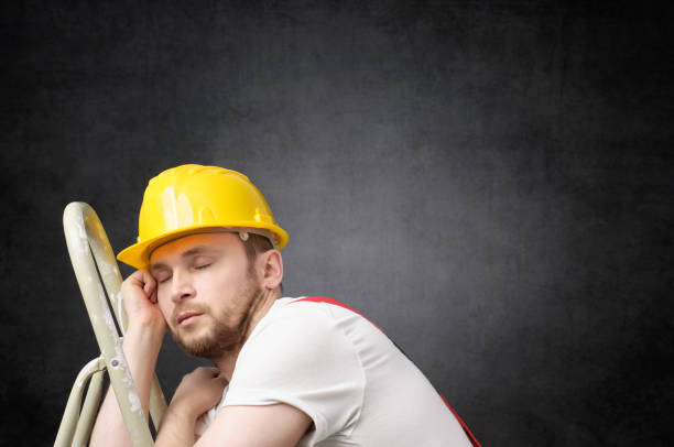 Lazy worker with ladder Lazy construction worker sleeping on a ladder lazy construction laborer stock pictures, royalty-free photos & images