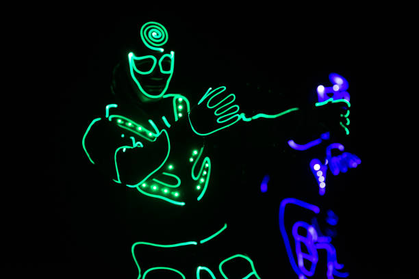 istock dance team in costumes of the LEDs, light suits 914533800