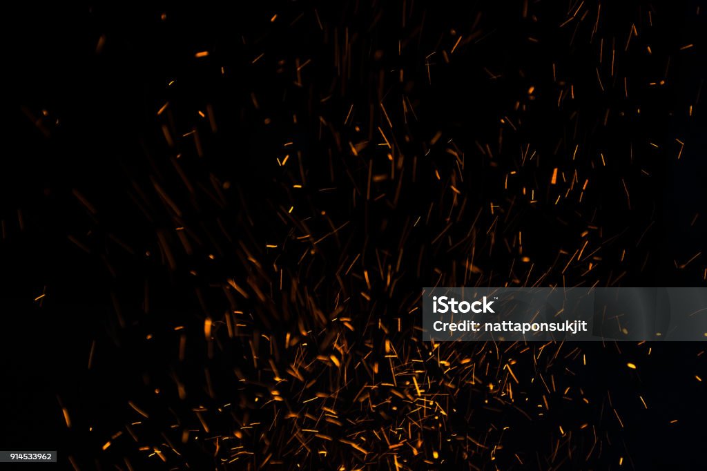 The flames of darkness float in the air.Fire charcoal. Sparks Stock Photo